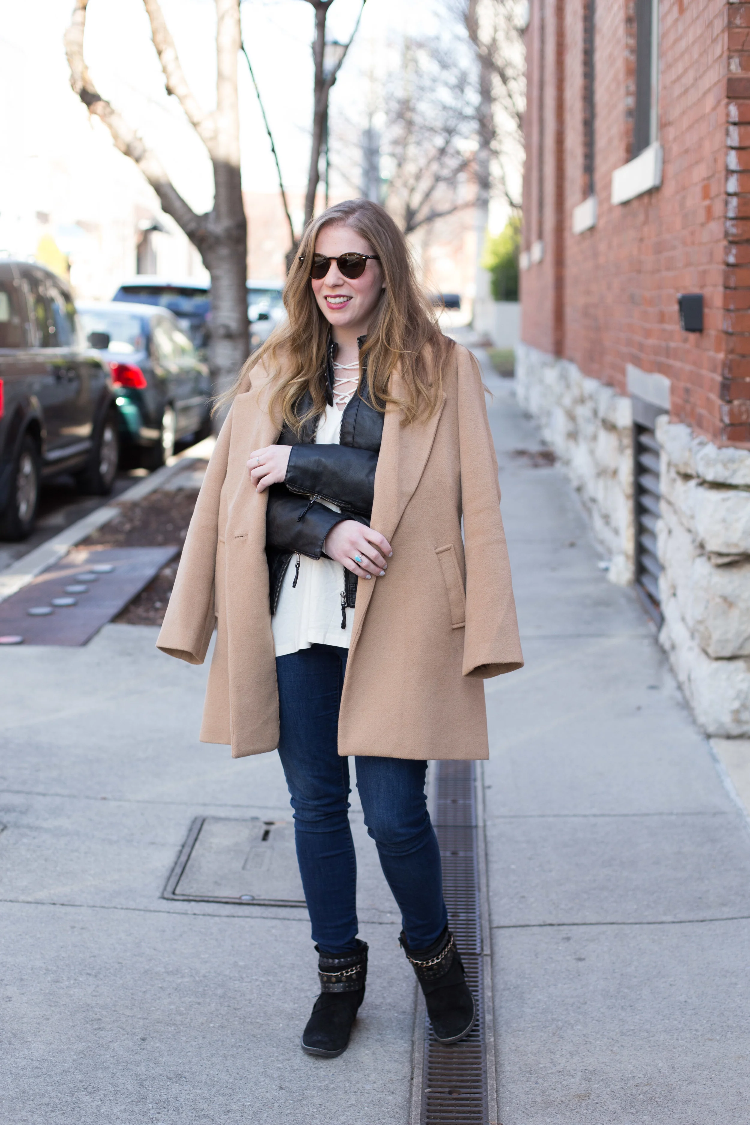 I can't get enough winter weather layering basics, like this leather jacket, overcoat in the perfect shade of camel, and simple blouse with lace-up detail. 