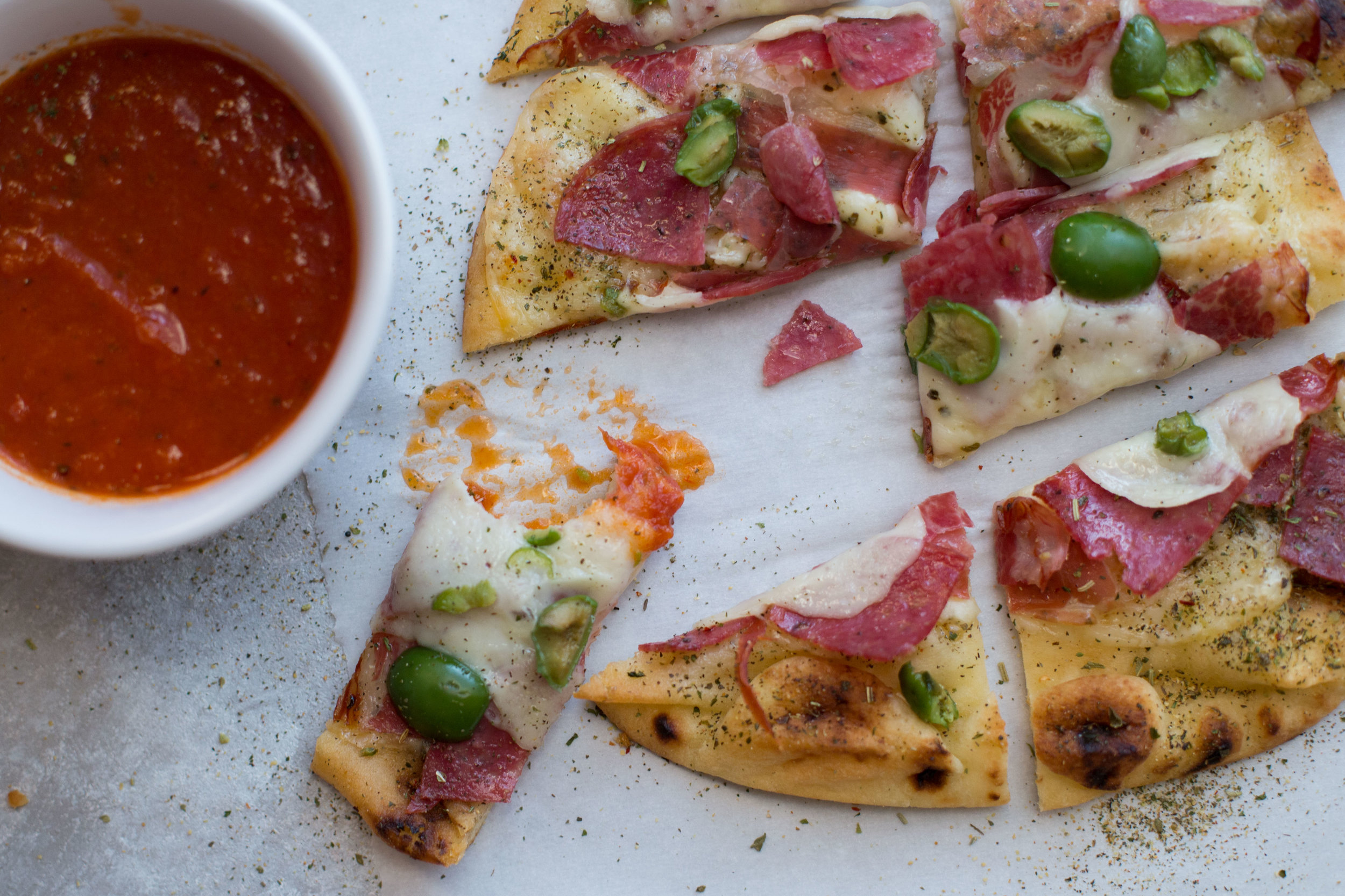 Toasted Naan with Capocollo, Prosciutto, Salami, and Castelvetrano Olives