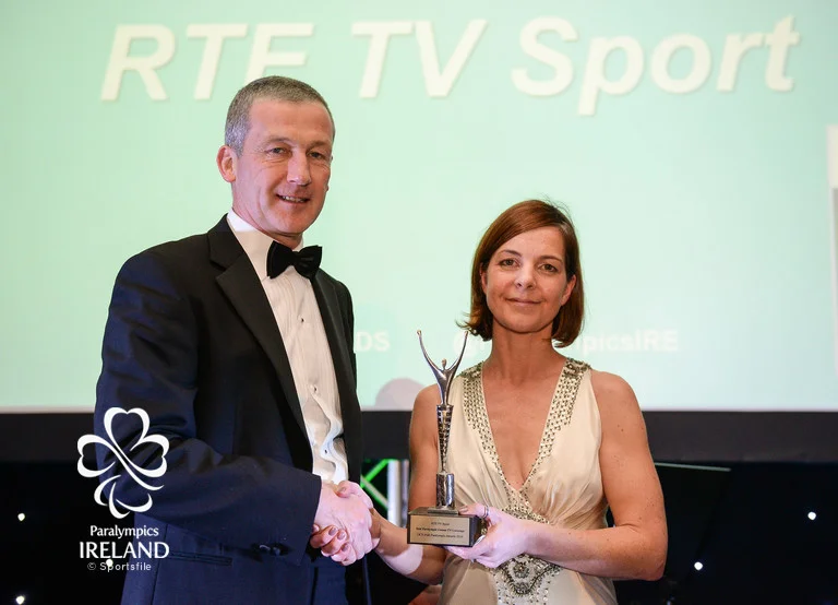 Cliona O'Leary, right, of RTÉ Sport, accepts the prize for Best Paralympic Games TV Coverage, from Cecil Ryan, OCS Europe, at the OCS Irish Paralympic Awards