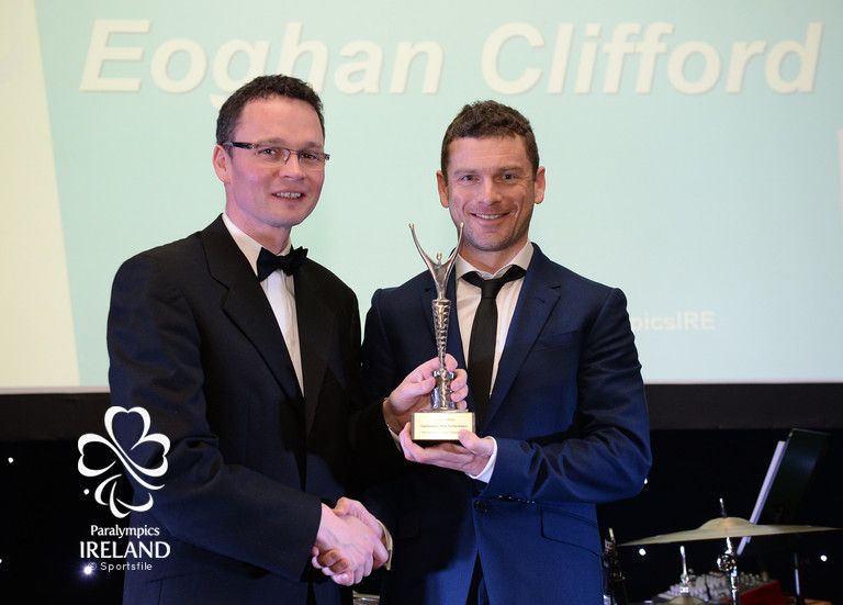   Eoghan Clifford, from Galway, accepts the prize for Outstanding Male Performance, from Minister of State for Tourism and Sport Patrick O'Donovan T.D., at the OCS Irish Paralympic Awards  