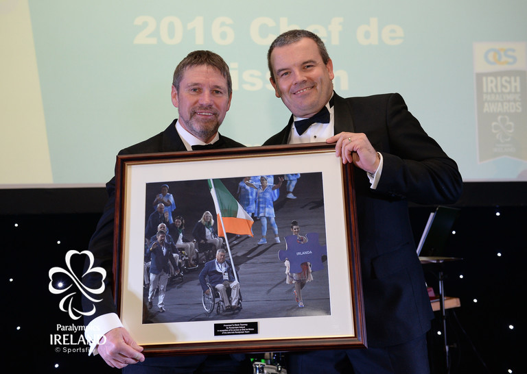   2016 Chef de Mission Denis Toomey, left, is honoured with a framed photograph by Liam Harbison, CEO Paralympics Ireland, at the OCS Irish Paralympic Awards  