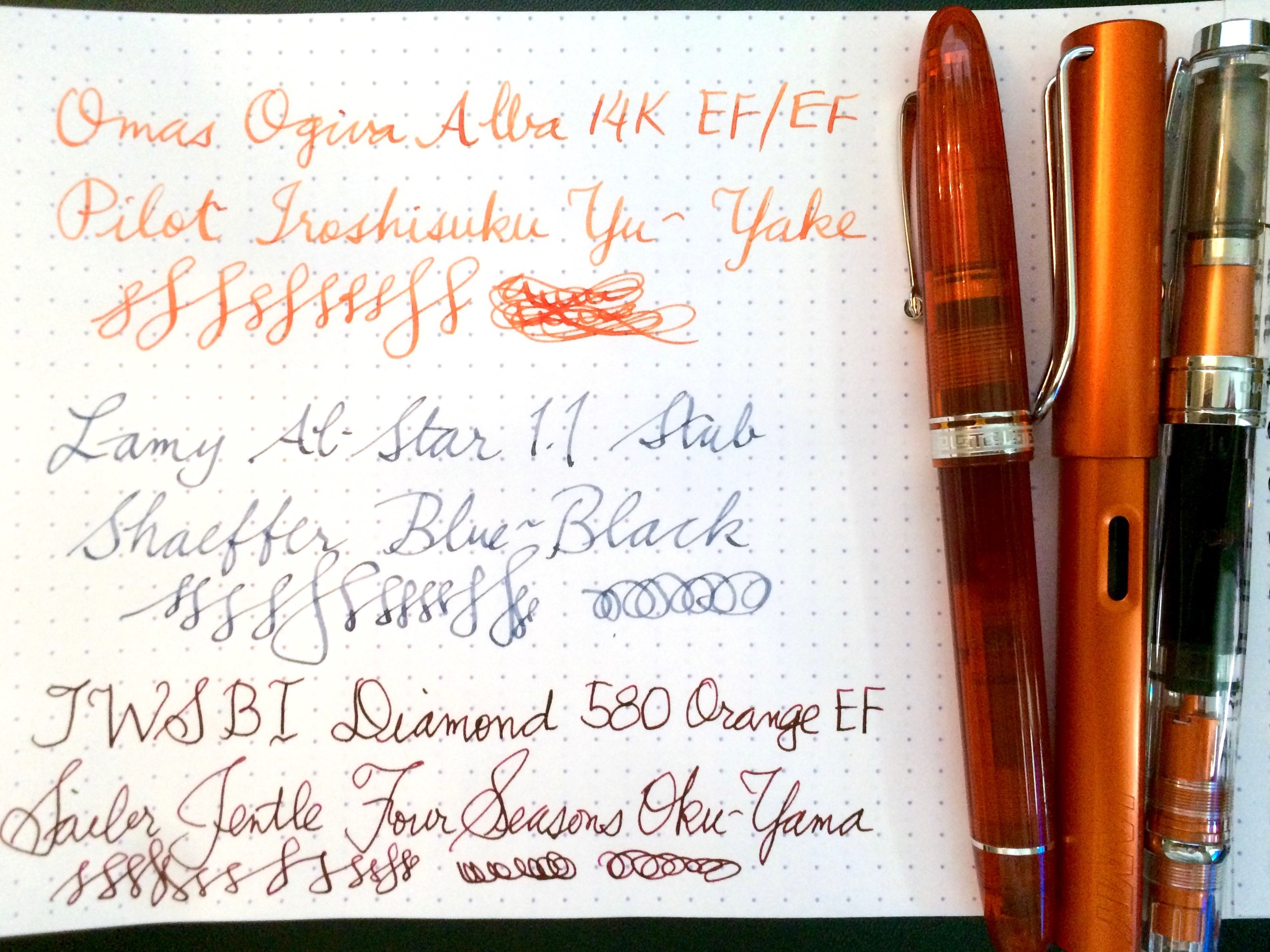 Writing samples with orange pens