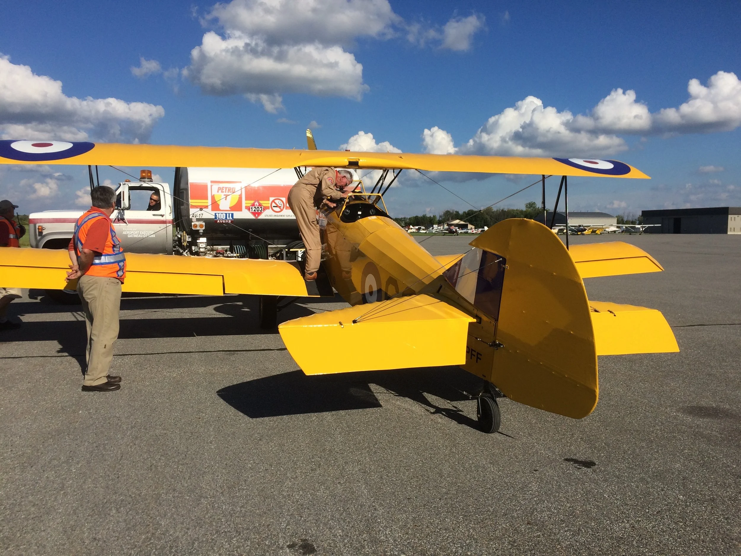 The Fleet Finch.  My pilot is checking the aircraft while it's being fueled.