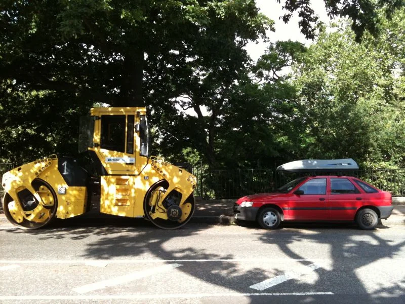 This was the scene outside my house this morning.
There was something very appealing about the car with its roof box parked up next to the steam roller…