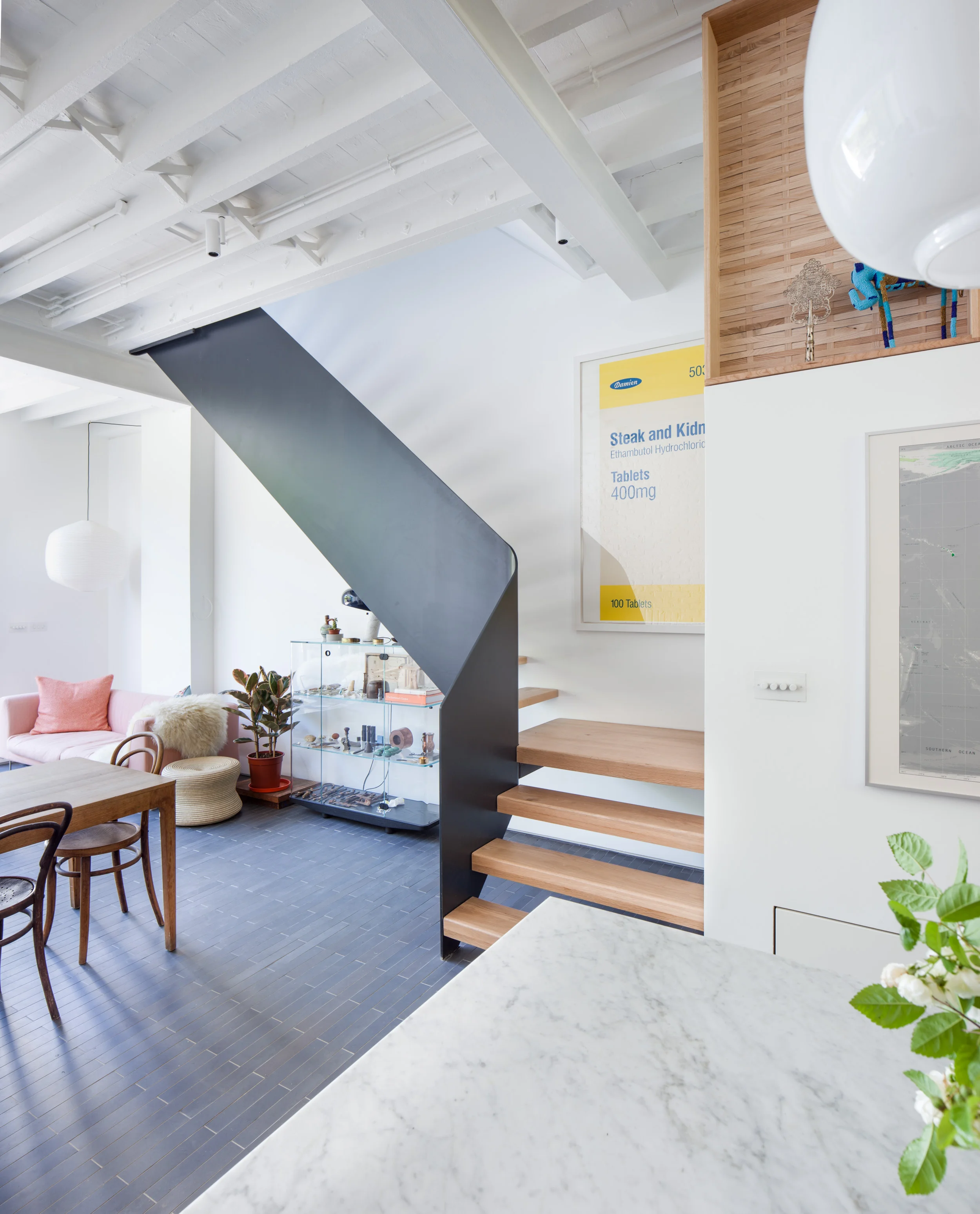 Staircase and Kitchen at Manor Avenue residence photographed by architectural photographer James Whitaker