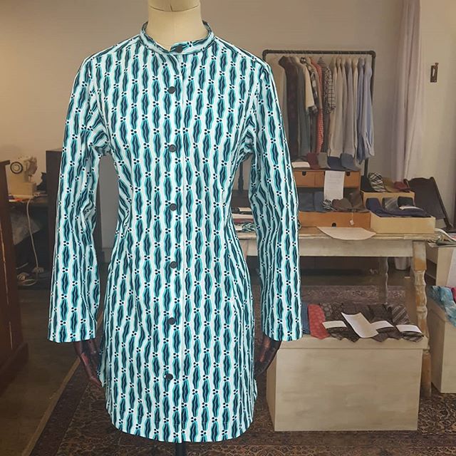 This is another unique custom piece that we recently finished. This client was inspired by a kaftan we had made for someone else. She liked the deep side slits with a self-faced hem; however, she wanted a more jacket-like feel with a banded collar, l