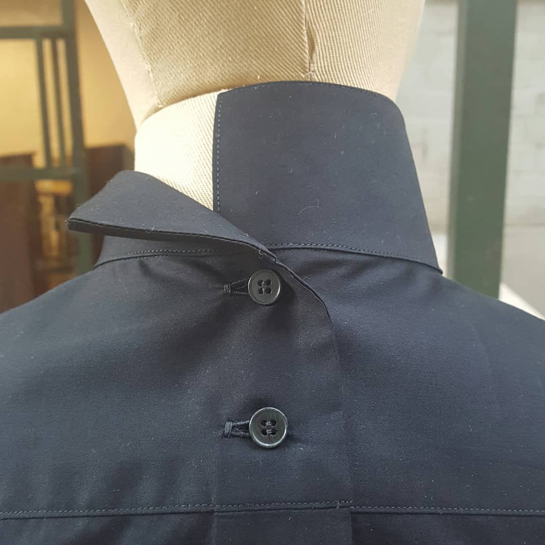 This client wanted a shirt that opened in the back. There were a few issues we had to think about in the construction of a "backwards" shirt. The yoke (the section that goes across the shoulders) had to open in the center, which means the s