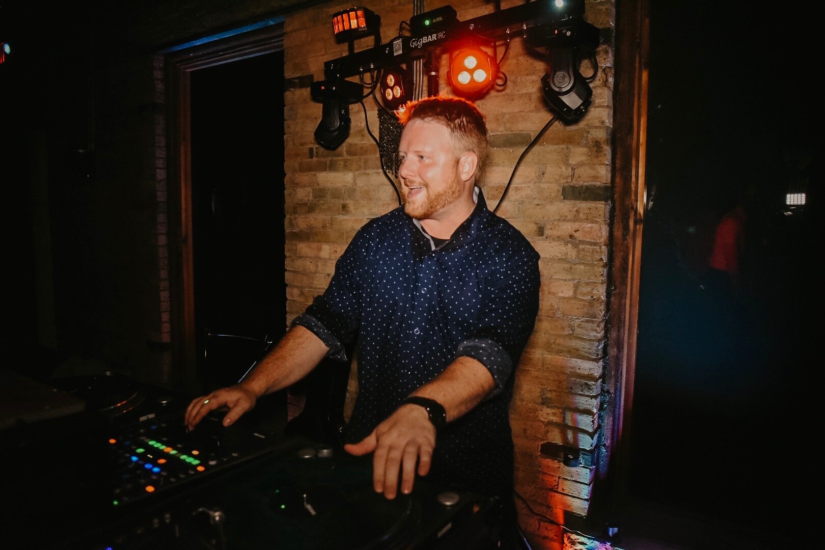 Ryan DJing smiling.JPG