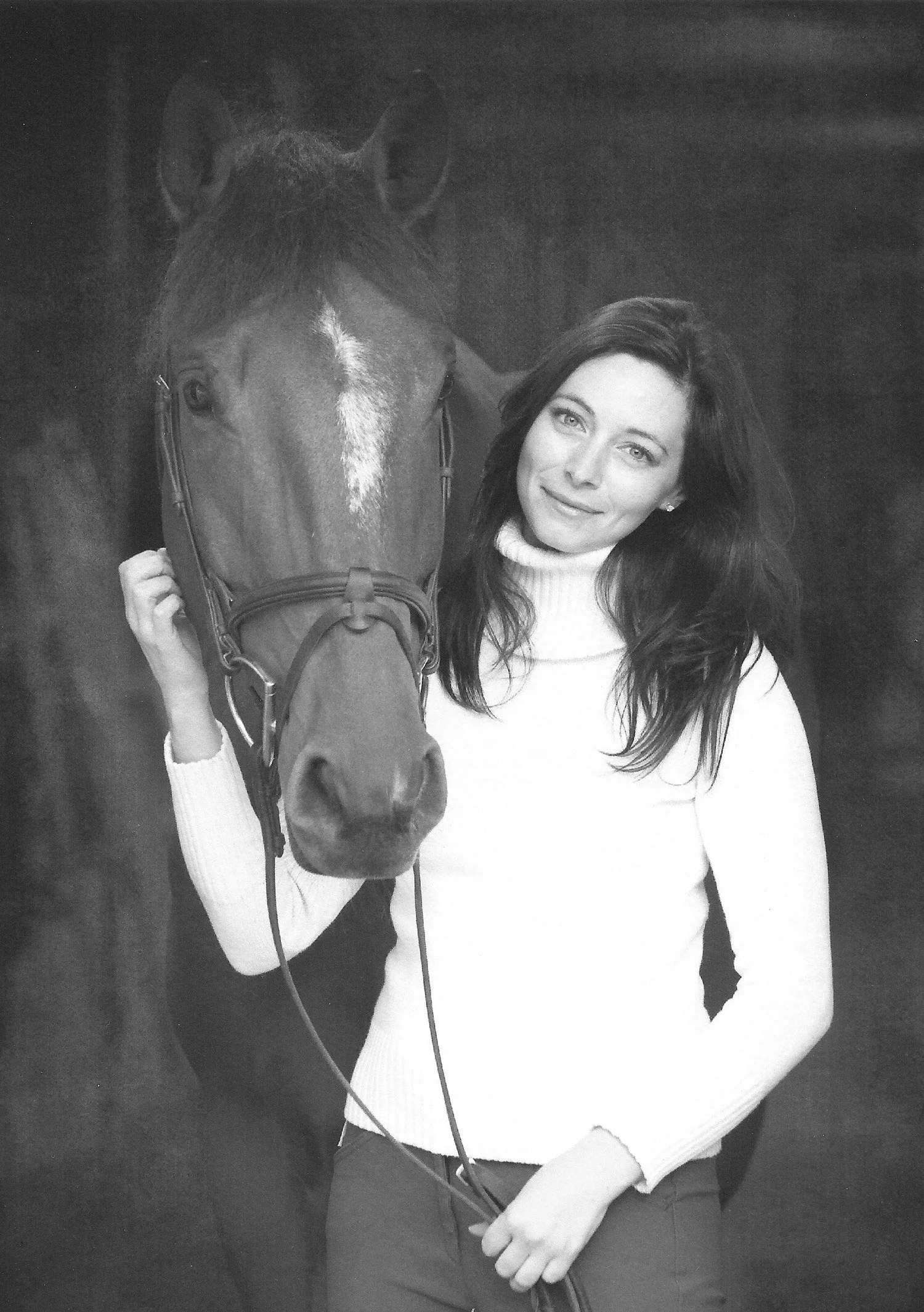 Portrait photo of Carolyn Nikolai and her horse Burberry K