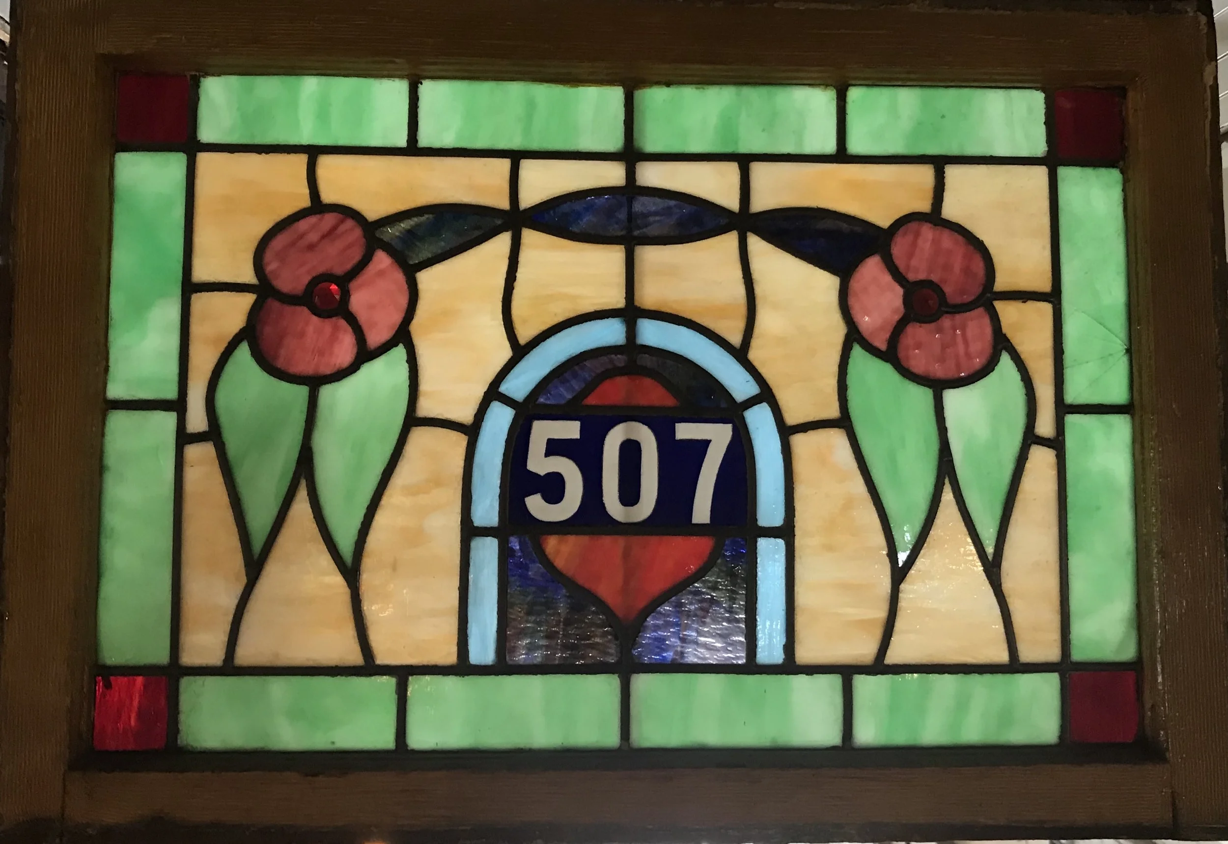 Antique slag glass numbered window