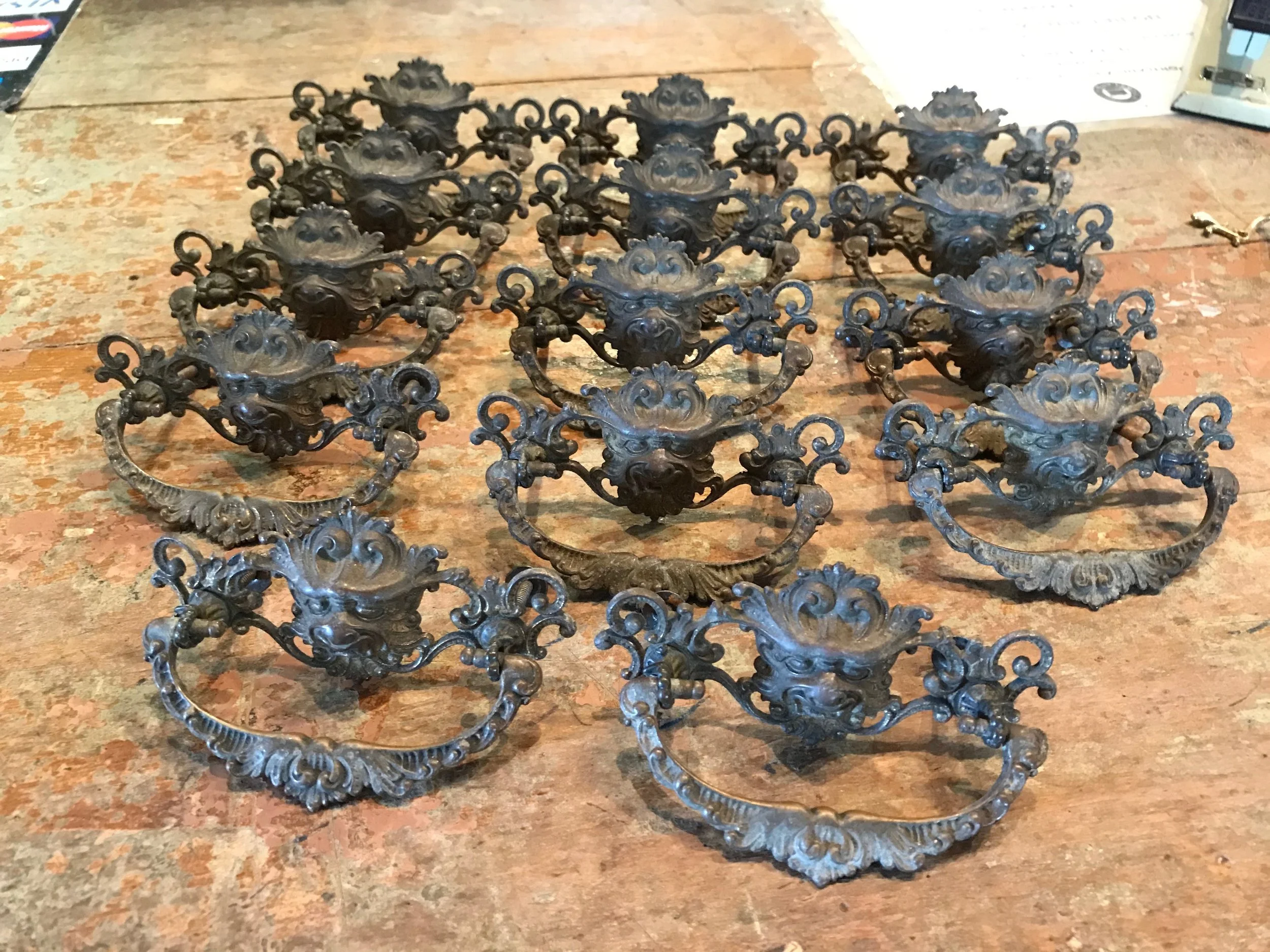 Antique cast brass Gryphon or Green man drawer pulls