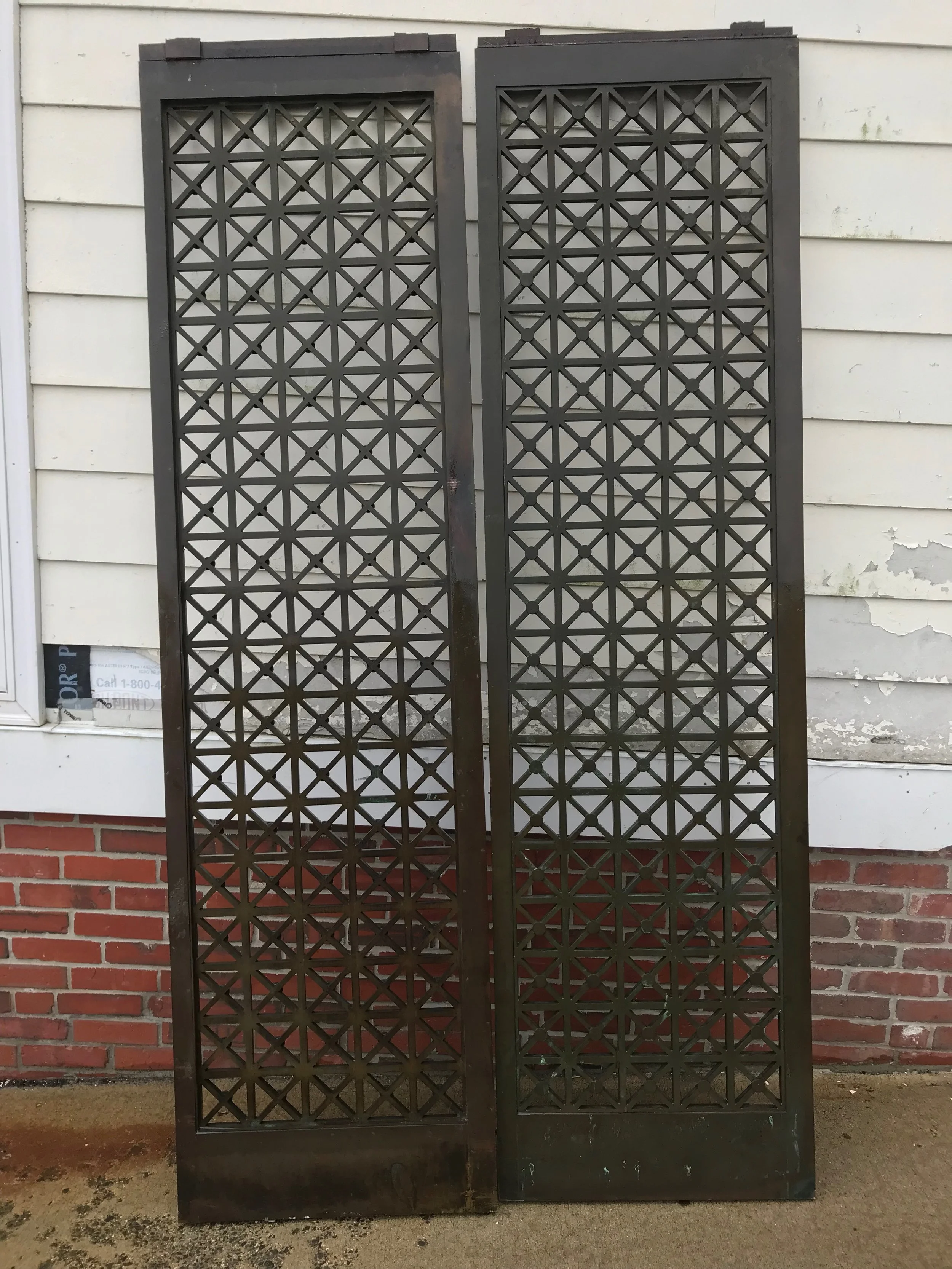 SOLD! Pair of Antique bronze elevator door grilles 