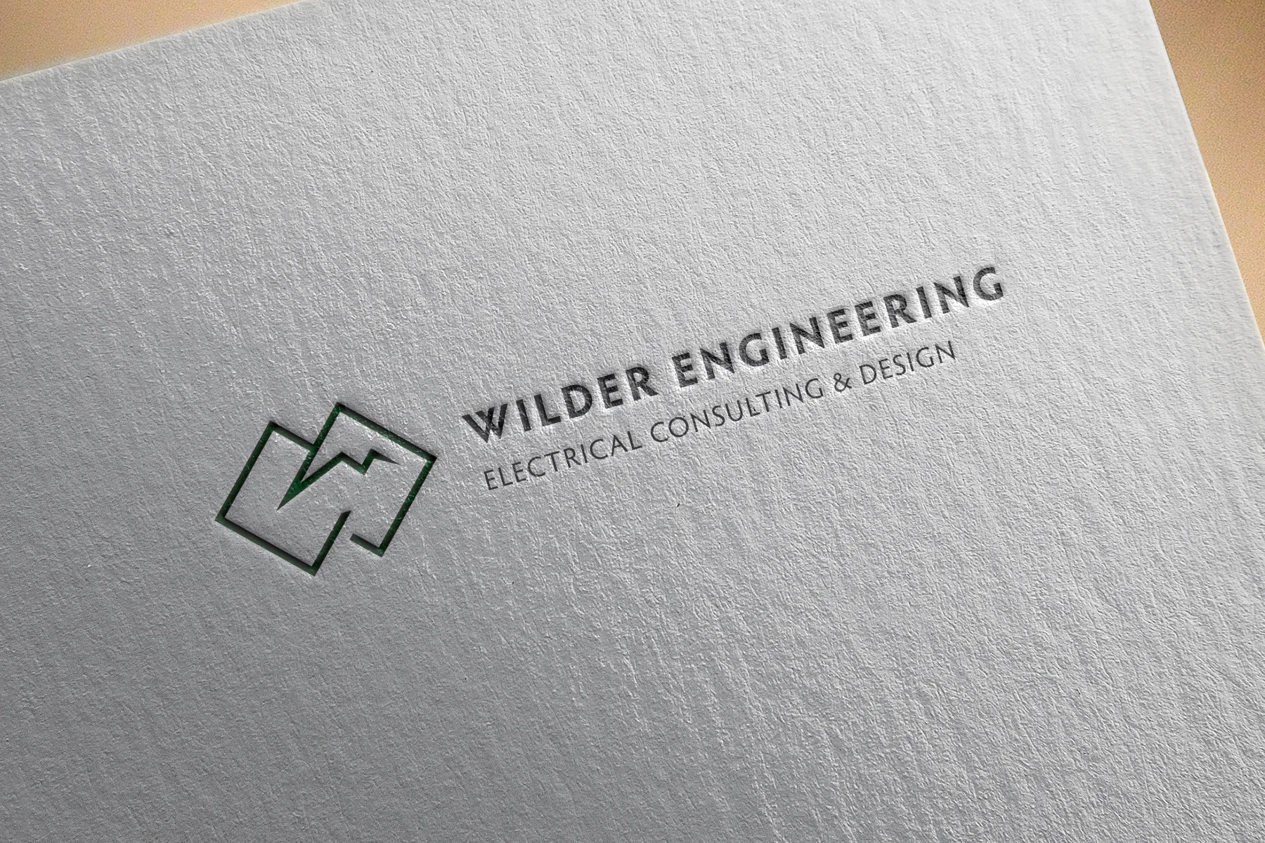 Iconic representation combining the idea of mountain peaks, snow/electricity, and the letter ‘W’.