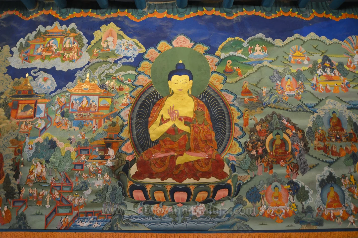 This beautiful mural is in the Buddhist Monastery Hemis, in Ladakh ("land of high passes") , a region in the Indian state of Jammu and Kashmir . The technique is most likely "Fresco Secco" (Fresco-secco is a wall painting technique where pigments mixed with an organic binder and/or lime are applied onto a dry plaster. The paints used can be casein paint, tempera, oil paint, silicate mineral paint.) They also would be painted on cloth and hung over a wall. The care and attention to detail is remarkable, as well as the exquisite colors. Murals not only honor the Buddhist teachings, they assist in communicating ideas, concepts and stories. It's interesting to compare a Buddhist mural to one of the Italian Renaissance. The Buddhist artists have no interest in imitating "real" 3D space. With a spiritual point of view that all time happens at once, then it makes sense. There are thousands of murals in all of the monasteries from northern India through Tibet, Nepal and into China and Korea. Many have survived for centuries in the dry climate of the Himalayas. Image courtesy of Amit Pahuja's Travelogues