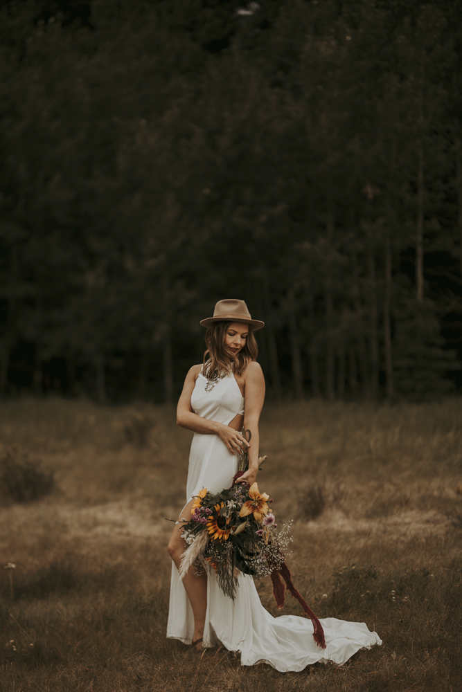 Bride Posing with Bridal Bouquet for Wedding Photos in Banff