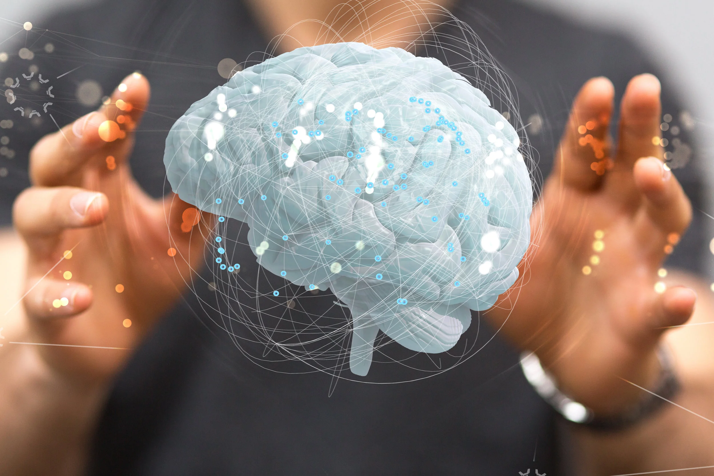 Hovering Brain above hands_ AdobeStock_123391828.jpeg