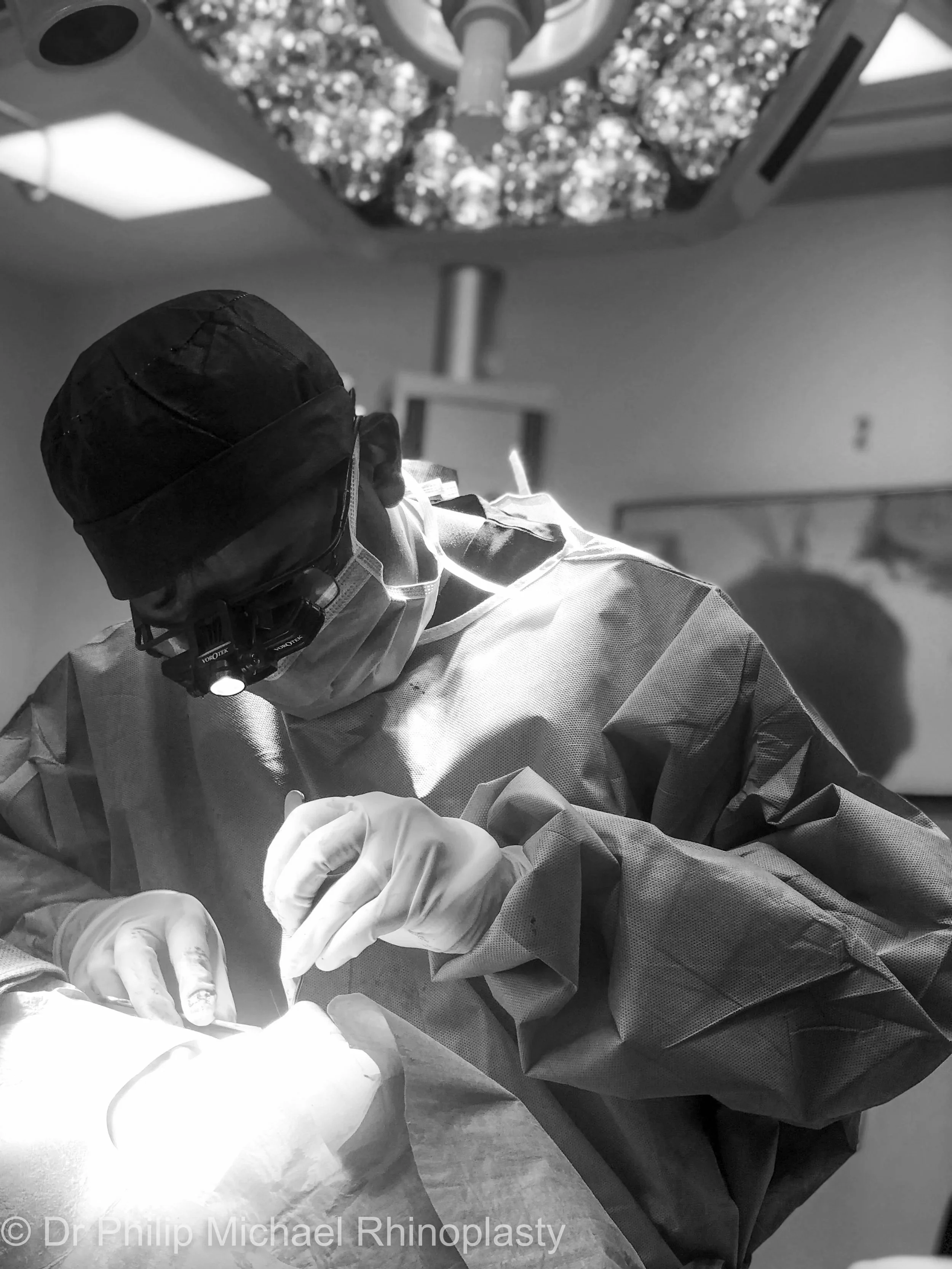 Dr Philip Michael performing rhinoplasty surgery in the operating theatre