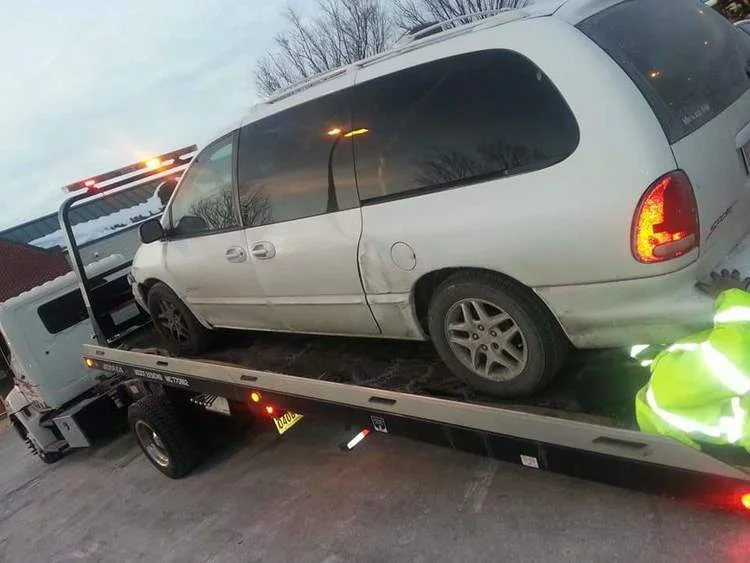 My Dodge Caravan being hoisted up by AAA.