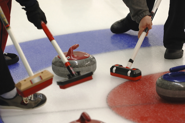 Brooms are used to sweep frost away from the stone's path. ©iStock