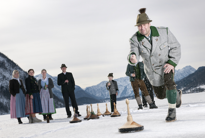  A group of people playing on a frozen lake in Austria ©iStock
