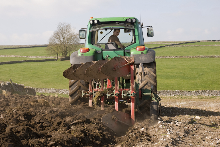 Tractors plough the fields. ©iStock