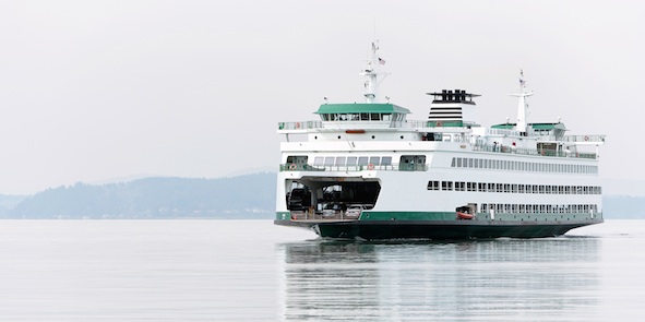At the front of this ferry there is a ramp that can be raised and lowered to let cars drive on and off. Getty Images