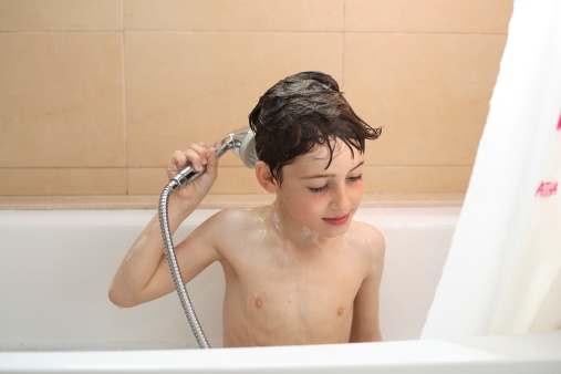 Rub shampoo into your scalp and rinse well to keep hair clean. Getty Images