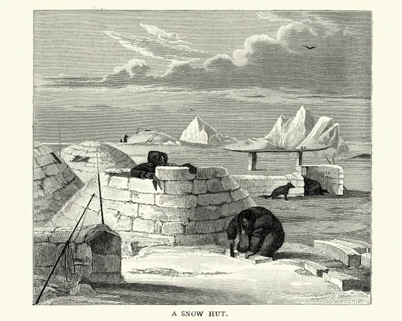 Cutting blocks of ice to build an igloo in the 1800s. © Getty Images