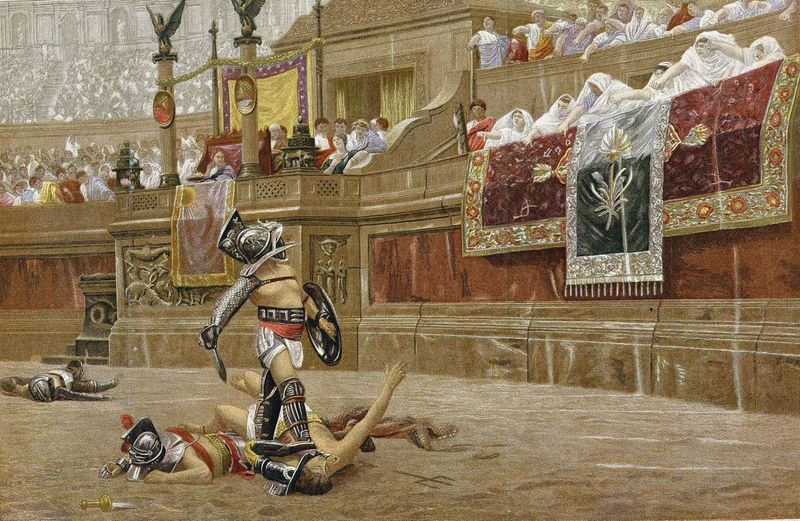 The winning gladiator asked the crowd whether or not the defeated gladiator was to be allowed to live or was to be killed. © Jupiterimages Corporation