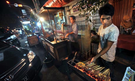 There are many street peddlers in the streets of Jakarta, selling food and souvenirs.