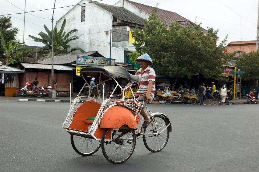 This 3 wheeled vehicle is called a becak (say bee-chack). It carries one or two passengers