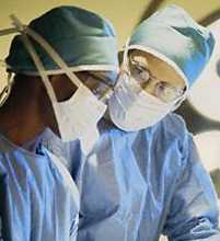 Surgeons cover their clothes, hair and faces when operating on a patient. Getty Images