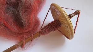A spindle (also called a drop spindle) is an ancient form of spinning wool into yarn. ©Getty Images
