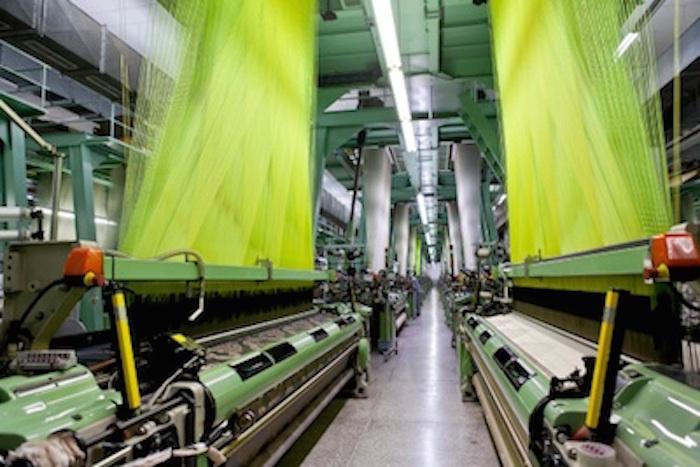 Silk threads going into the weaving machines at a silk factory. Getty Images