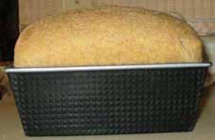 A loaf of bread ready to take out of the oven. Getty