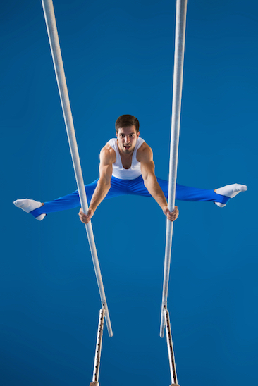 A gymnast performs a routine on the parallel bars © Getty Images