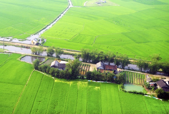 Small farming village along a canal. Image©iStock
