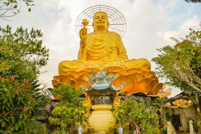 Statue of Golden Buddha, Dalat, Vietnam. Even on a cloudy day it glows. Photo©iStock