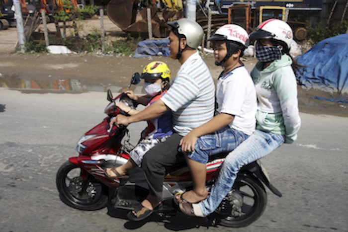 A Vietnamese family on scooter. Photo©iStock