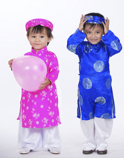 Girl and boy wearing new ao dai for New Year. Photo©iStock