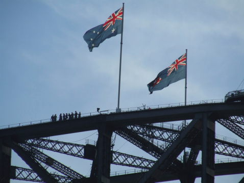 Since 1999 groups of people are taken on climbs to the top of the arch of Sydney Harbour Bridge. Getty Images