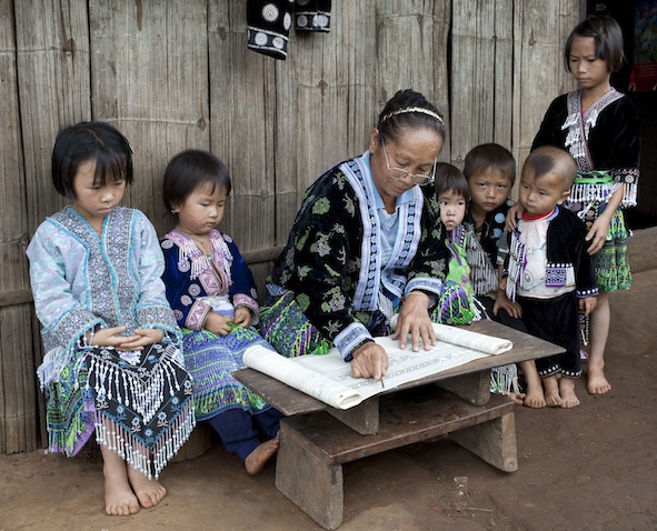 A Meo village school. They are all wearing Meo traditional clothing. iPhotos.com