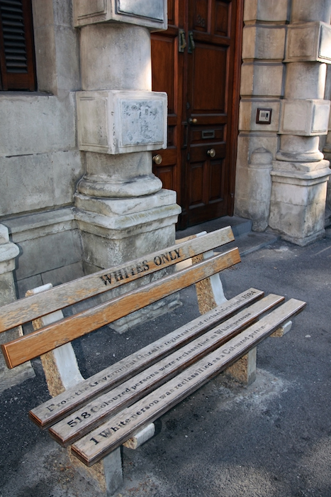 Non whites could be punished for sitting on a bench that looked the same but was labelled like this. Photo©iStock