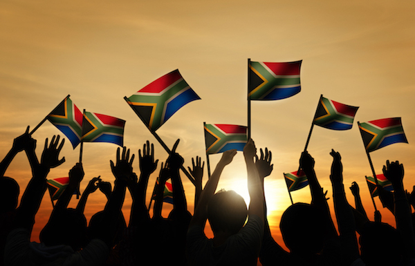 The flag of South Africa was adopted on 27 April 1994. The black, green and yellow are from the banners of the three black organisations and represent the black citizens of the country. The red, white and blue are from the Dutch and British flags and represent the white citizens of the country. The Y shape represents the unification of all ethnic groups as coming into one path so past and present join and lead into the future.