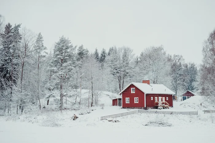Houses in cold places have small windows and steep roofs so the snow slides off. ©Getty