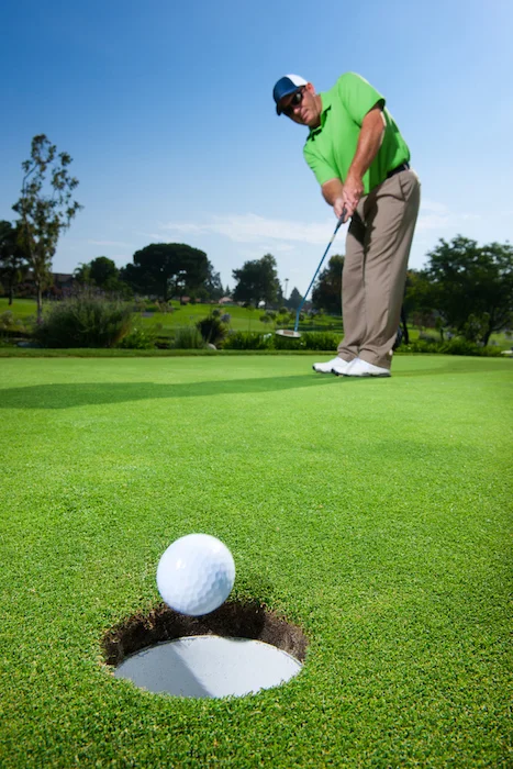 The putt is successful! The ball is about to drop into the hole. ©Getty