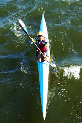 This single athletes paddles and steers the canoe with a single oar with a paddle at each end during a sprint race. ©iiStock