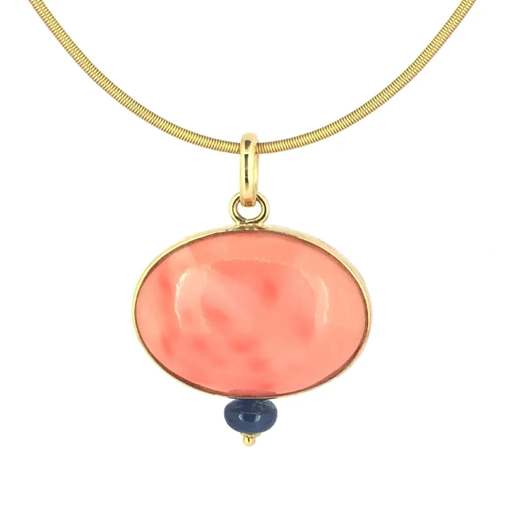 PEndant of vintage Angel Skin Coral with sapphire in 18K