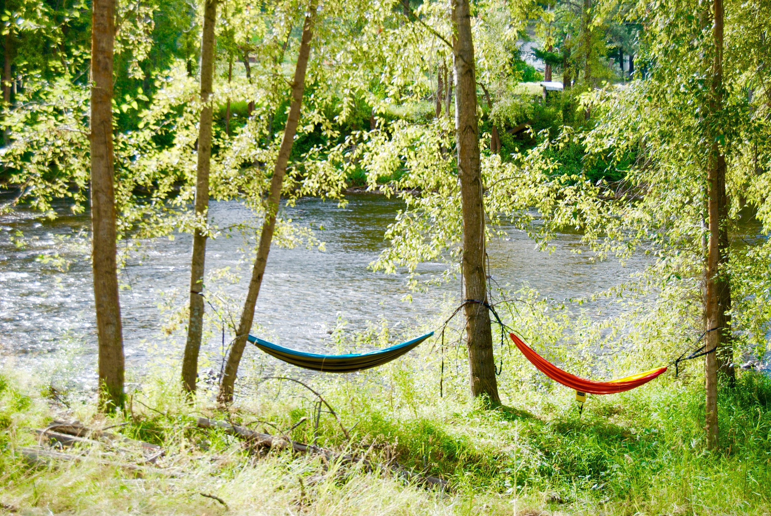 These hammocks belong to me and my friend Maya. We set up camp there all weekend and enjoyed the passing of the hours, the gentle sound of the river, great music coming from neighbors, twinkling stars, and a few naps. This year the weather was so nice that I spent one night in my hammock. Sleeping bags are definitely recommended. Cuddles optional. I mentioned this place is a place for community. That means at no point did I feel the need to worry about leaving my hammock there or the risk of having it stolen. I did get a lot of compliments in my placement. Not going to lie, I put it on a very sketchy ledge. But hey, when you find the perfect view, you make it happen. The fairground is right by Kettle River. It's a shallow lazy river. You can just set up your chair in a sunny spot, or bring your floaties and float on down the river. There are shuttle that pick you up and bring you back up to the festival so you barely have to do anything! Given that the stage is right on the other side of the river, you can either use the sound of music as your clock, or you can just choose to enjoy the music from your chair, or floatie. Just don't litter- that's not cool. Bring an ashtray and collect your beer cans. 