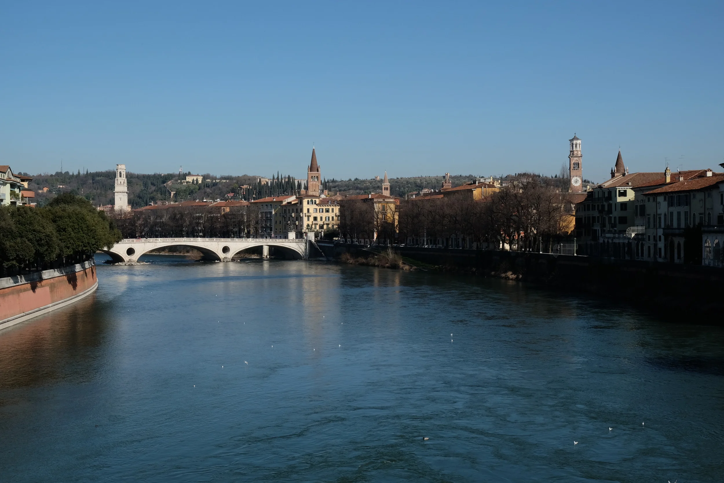 Adige River runs a perimeter around the center of Verona. Also, SO many church towers. Six just in this photo!